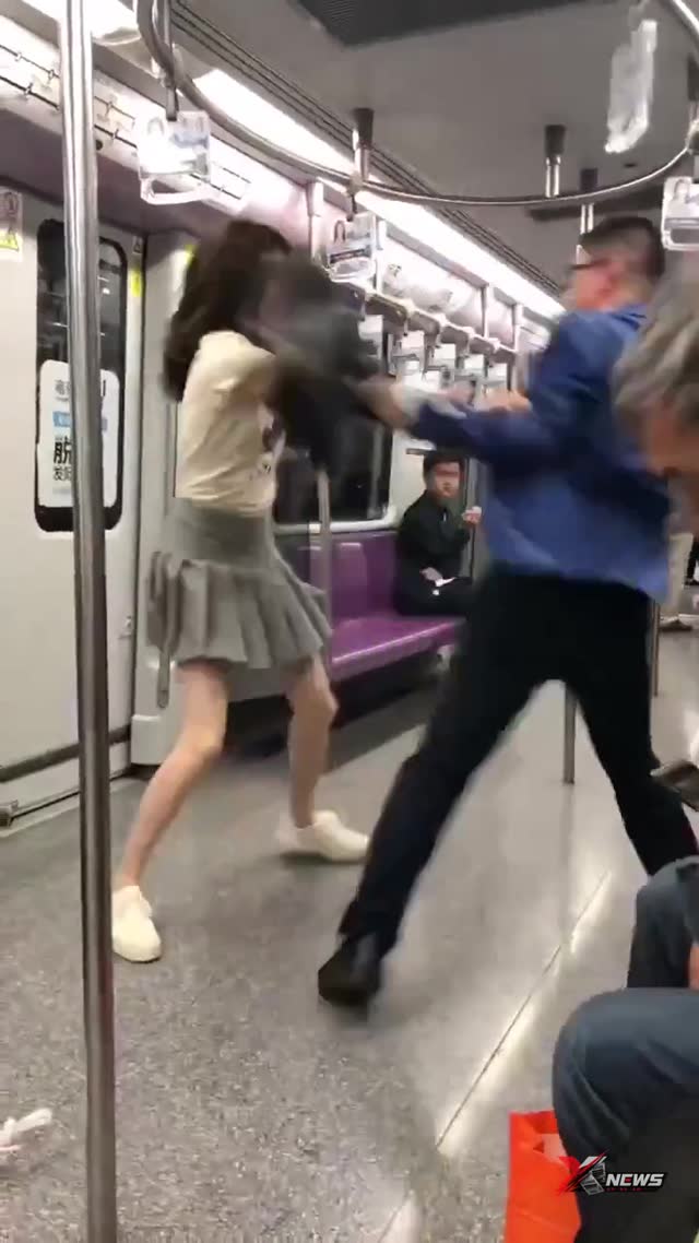 Subway Scene: Woman in Grey Skirt and Man with Orange Bag